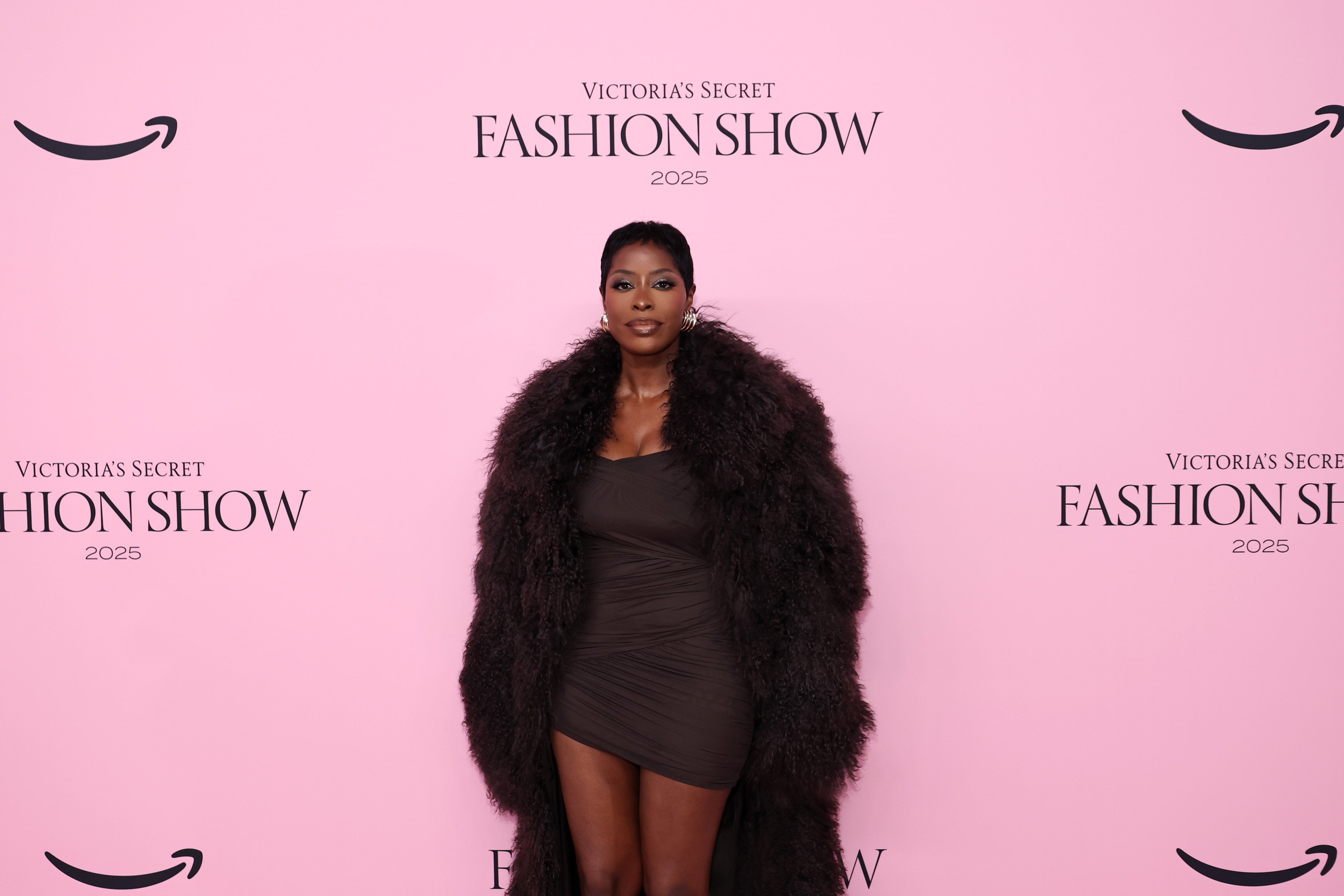 Eyewear Designer Jenee Naylor opted for a chocolate brown ensemble. She stunned in a mini dress and threw a fur coat on top